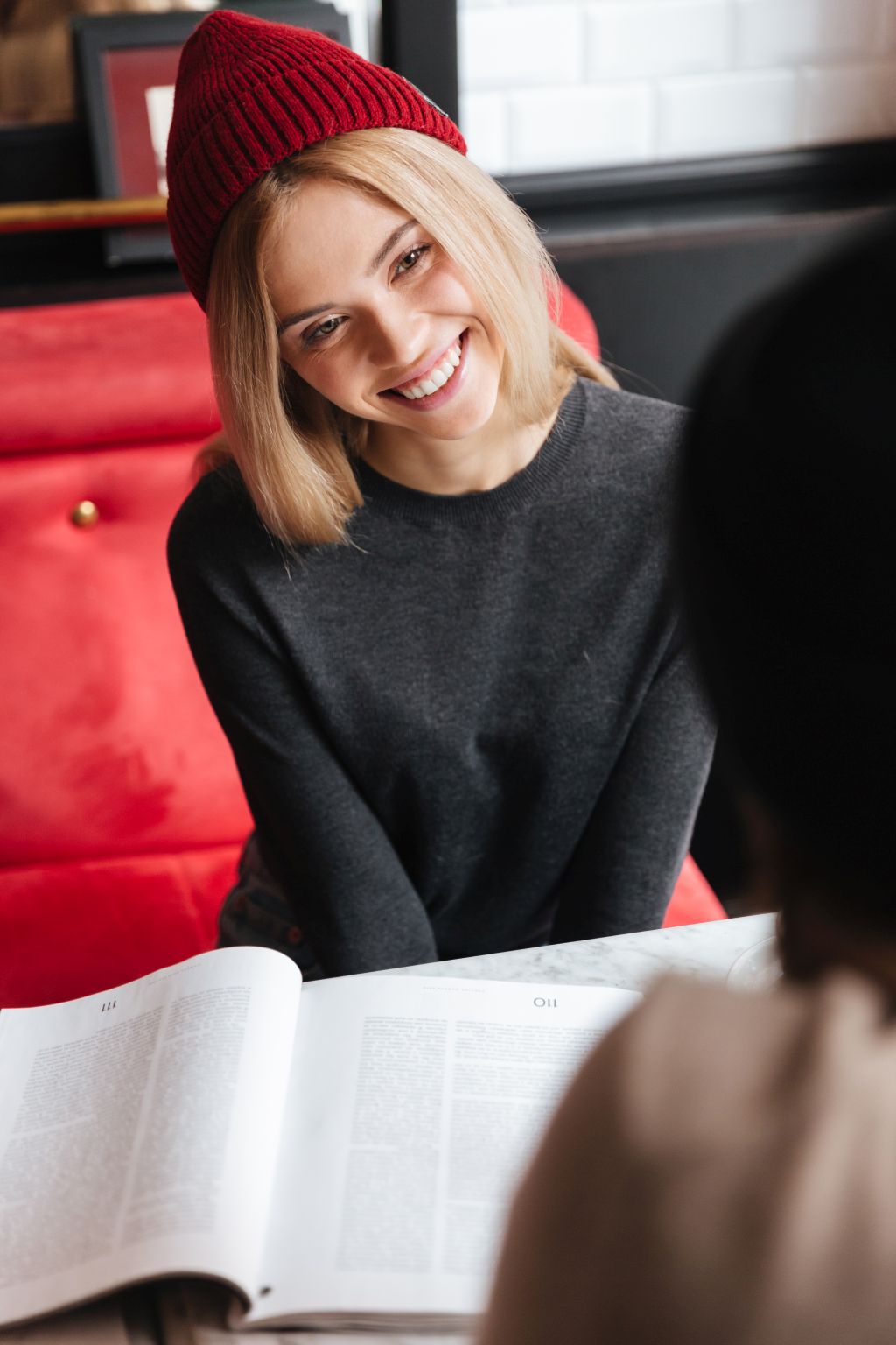 Vertical image of woman with man in cafe